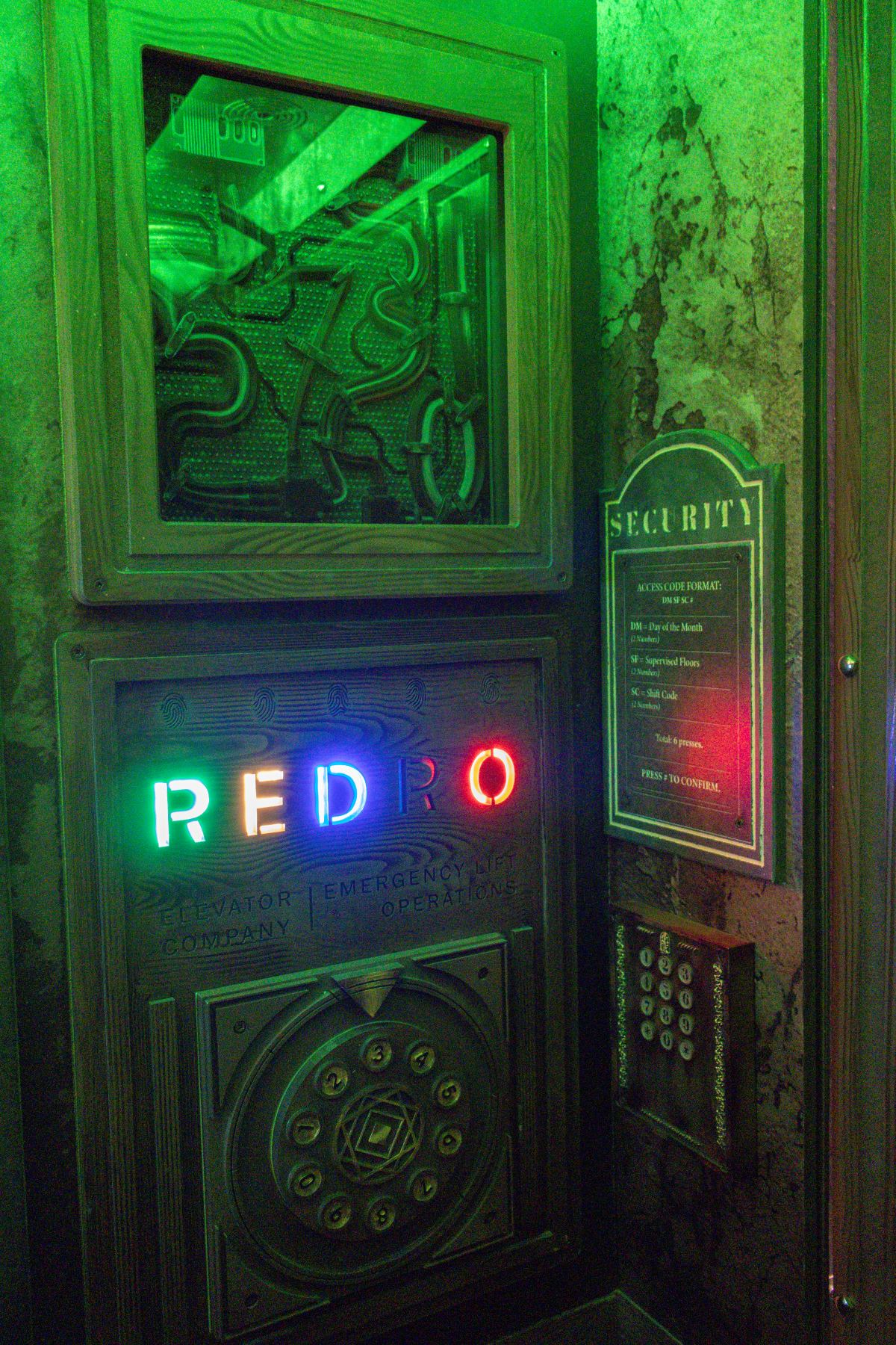 Green-lit Escape the Elevator puzzle and security controls