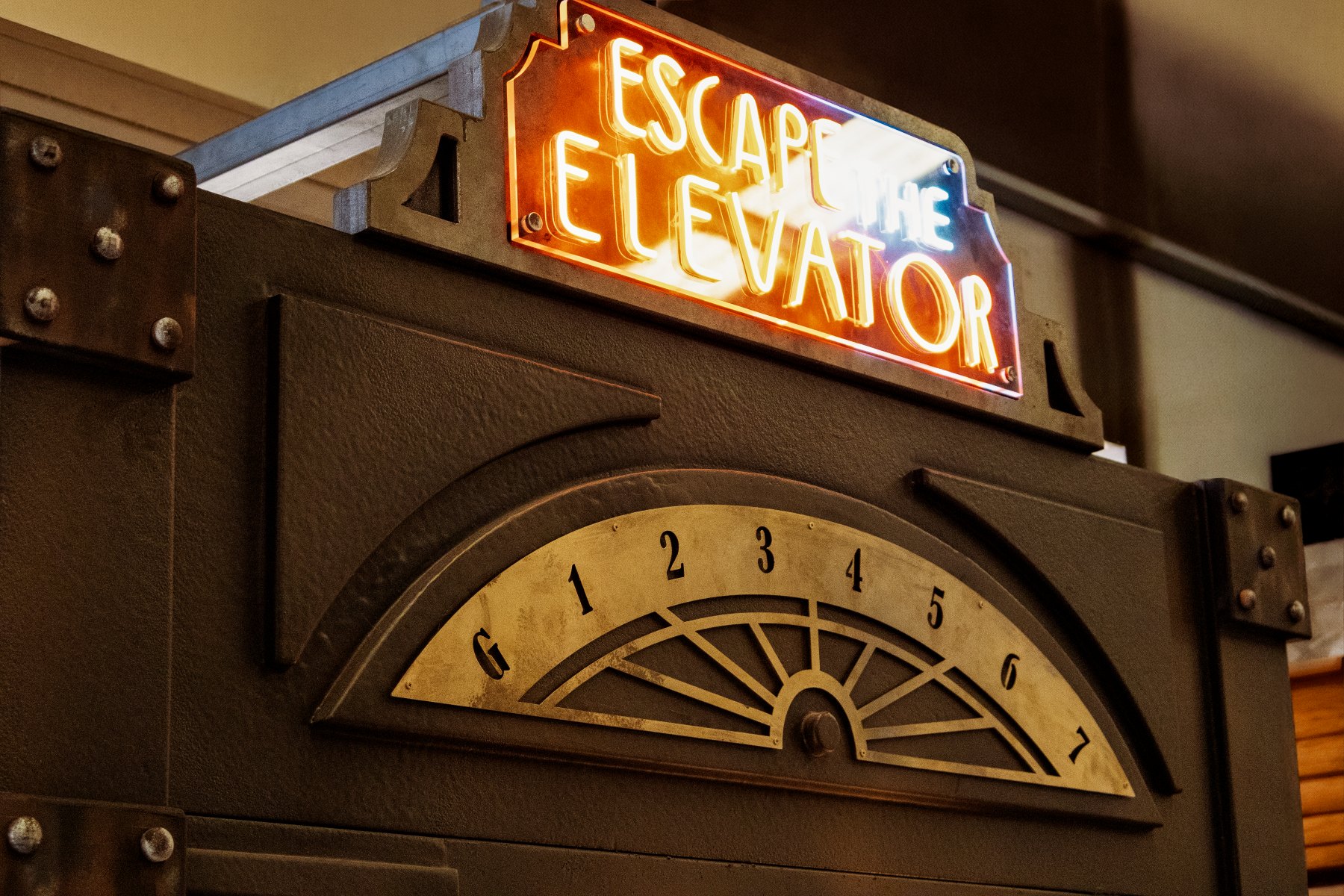 Illuminated Escape the Elevator sign and floor indicator